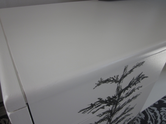 white credenza with trees